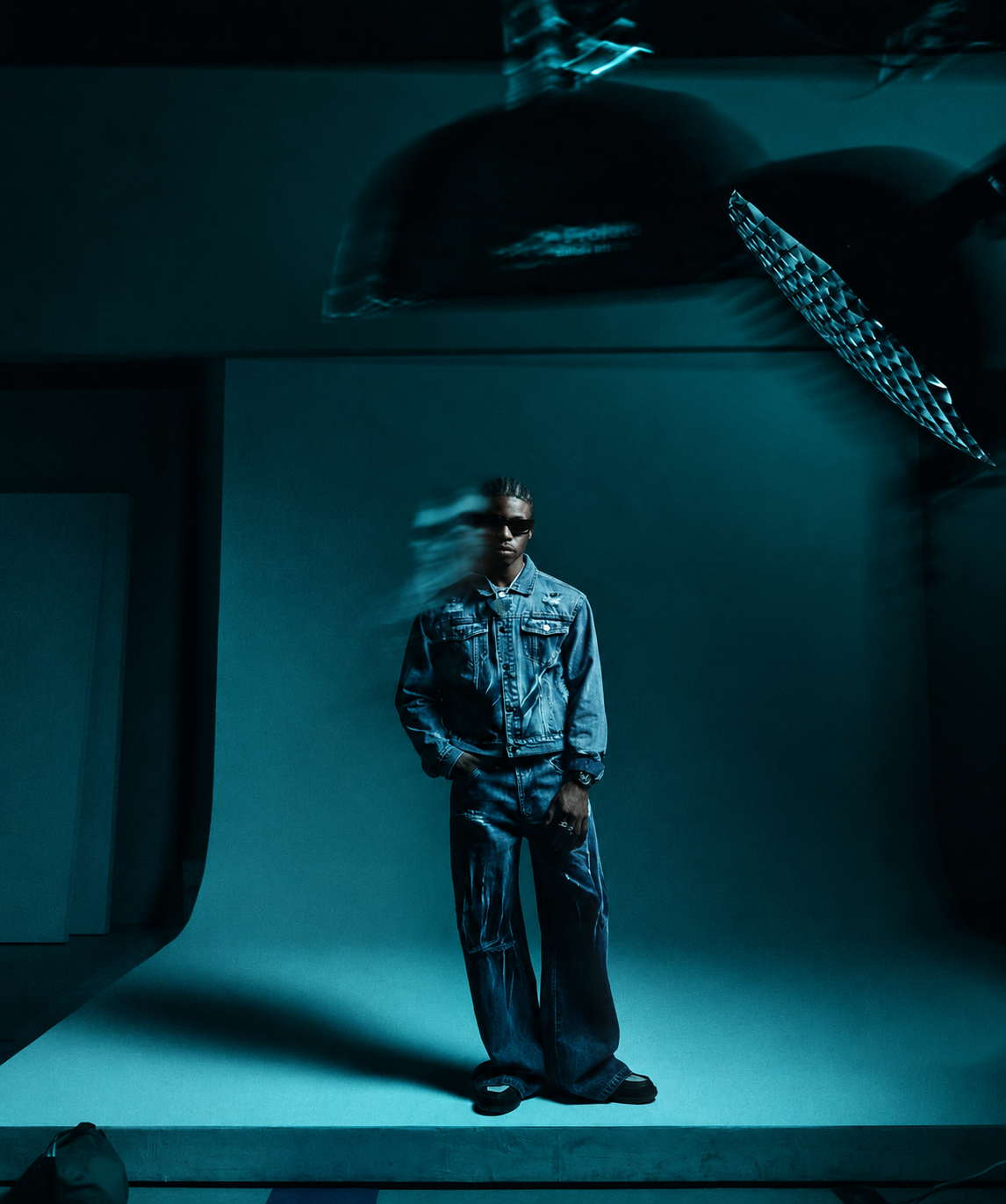Artist reference: a fashion portrait in a deep teal room.